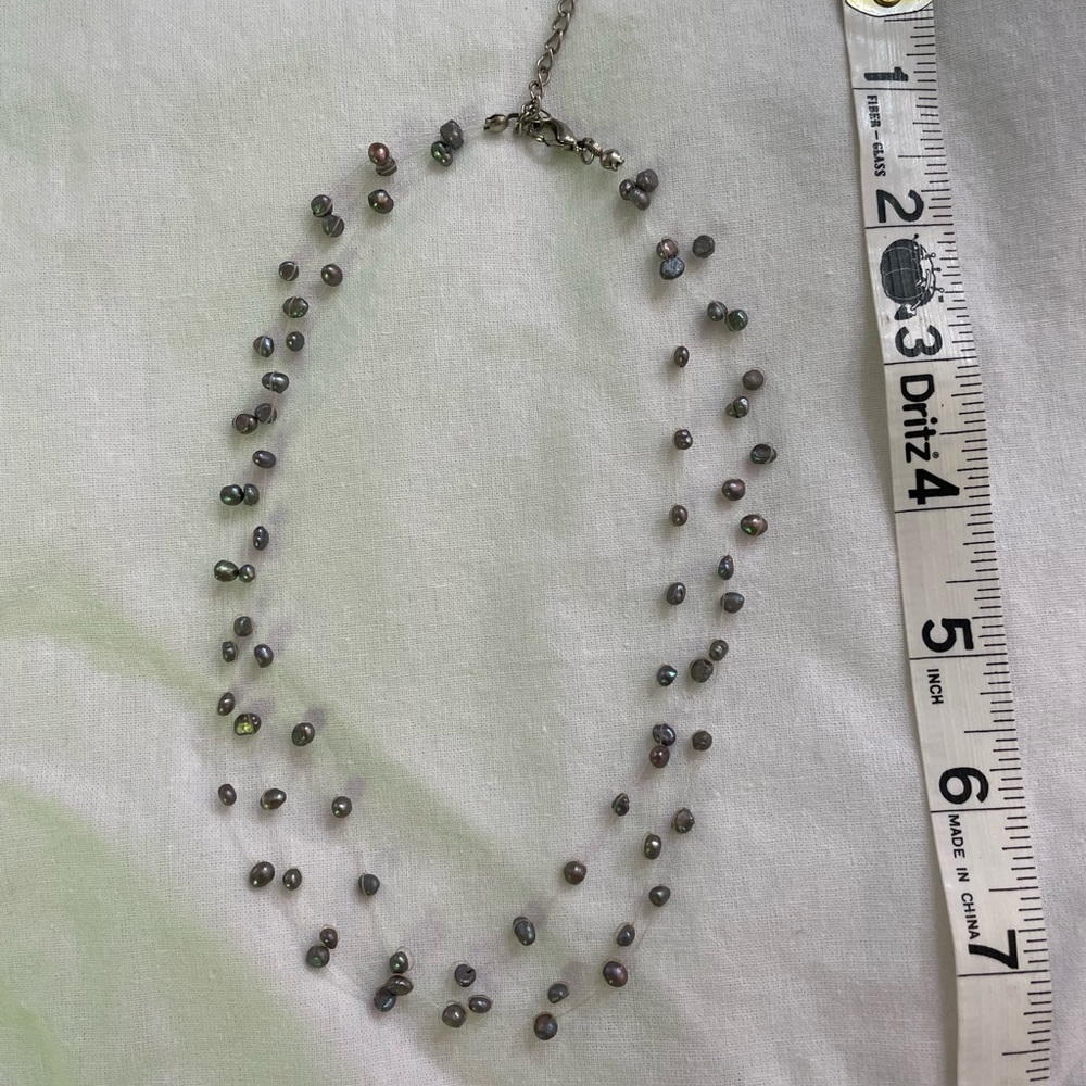 Classic three-tiered gray pearl necklace.  Costume jewelry purchased in Hawaii.